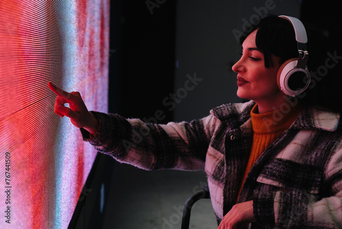 Curious Woman in Wheelchair at Digital Art Exhibition
