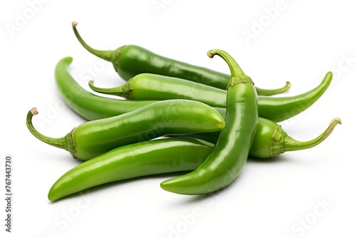 Ripe green hot chili peppers on white background