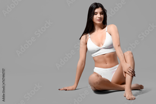 Pretty young woman in white...