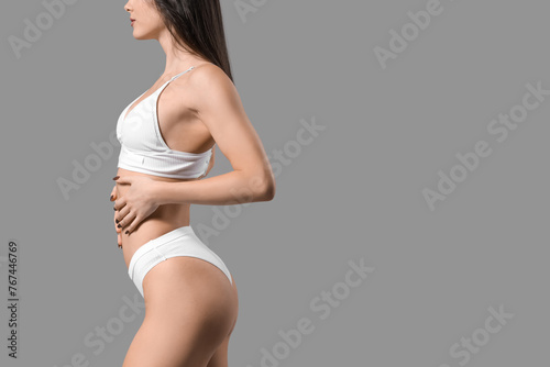 Pretty young woman in white...