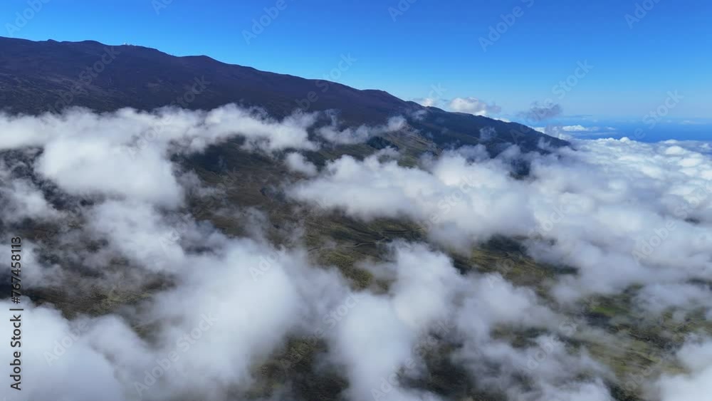 Aerial shot of above the clouds in Maui landscape. Aerial shot of above the clouds in Maui landscape.