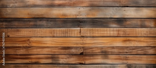 A closeup of a brown hardwood wall made of rectangular wooden planks, showcasing a beautiful pattern created by the wood stain on the planks