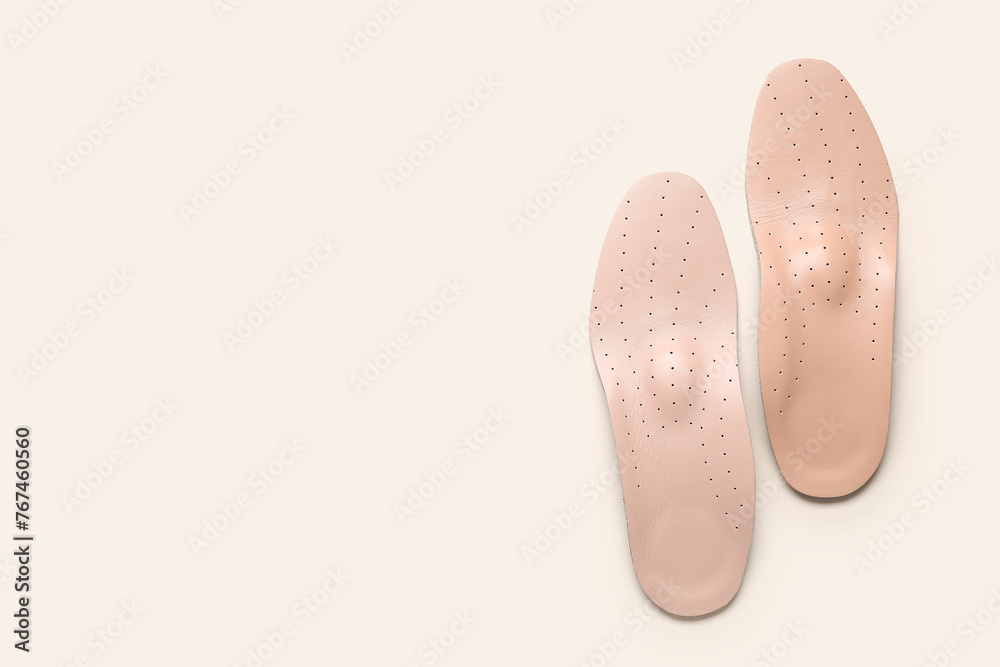 Leather orthopedic insoles on white background Leather orthopedic insoles on white background