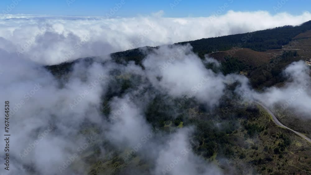 Aerial shot of above the clouds in Maui landscape. Aerial shot of above the clouds in Maui landscape.