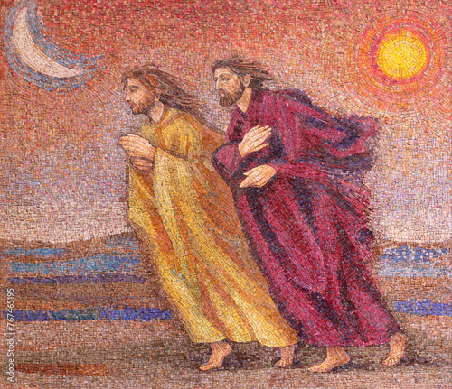 MILAN, ITALY - MARCH 8, 2024: The mosaic of St. Peter and John running to the empty tomb in the church Chiesa di Santi Quattro Evangelisti by Italo Persson and Silvio Consadori from 20. cent. © Renáta Sedmáková