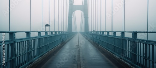 the suspension bridge disappeared in the mist photo