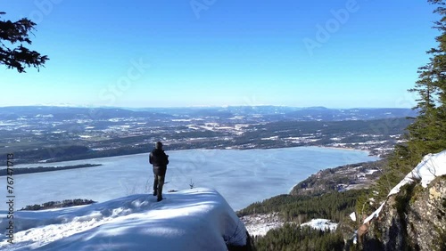 4K. Person in the mountains looking over the big fjord Steinsfjorden from the mountains. photo