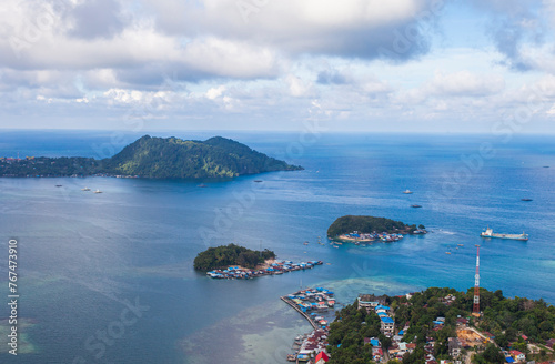 Aerial view of residential areas on small islands in Yos Sudarso Bay, around Jayapura City, Papua, Indonesia. Jayapura is the capital city of Papua Province.