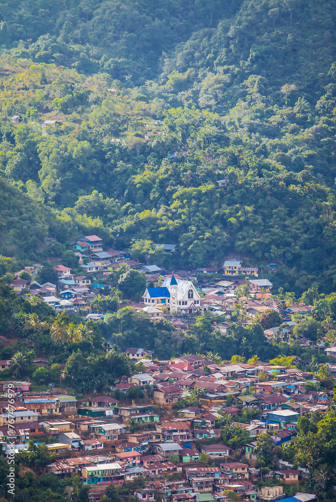 Settlement in one part of Jayapura City. Jayapura is the capital of Papua Province in Indonesia. This housing complex is sandwiched between hills and mountains.