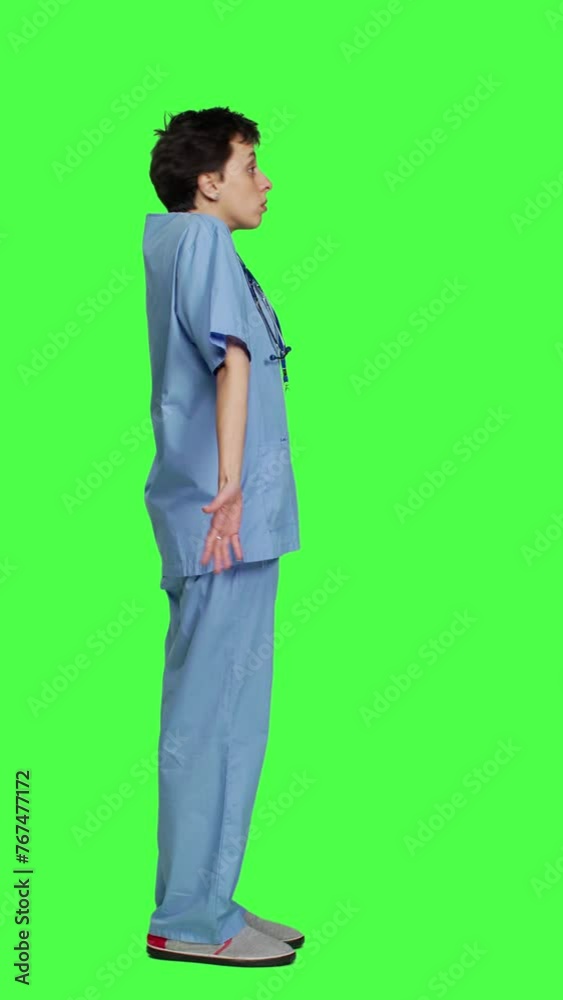 Profile Medical assistant shrugging and doing i dont know sign in studio, acting clueless and uncertain against greenscreen backdrop. Nurse in scrubs gesticulating doubtful reaction, unsure girl Profile Medical assistant shrugging and doing i dont know sign in studio, acting clueless and uncertain against greenscreen backdrop. Nurse in scrubs gesticulating doubtful reaction, unsure girl