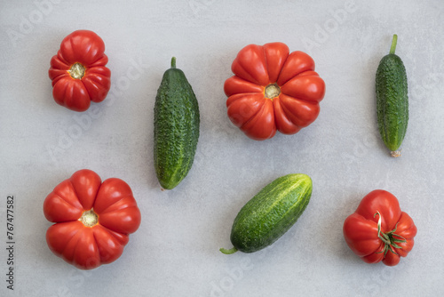 Oxheart Tomato and cucumber, Top view background. Balanced healthy diet photo