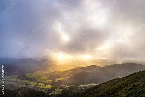 Sunlight through the clouds from a view to the valley  © Mark