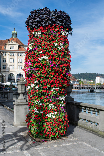 Flower tower along the Reuss River esplanade in Lucerne photo