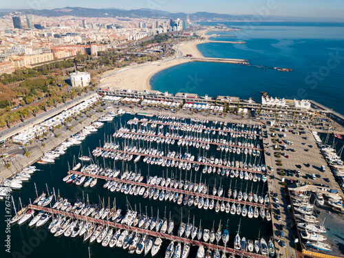 Aerial view of Mediterranean seascape with yachts moored in harbor of Barcelona