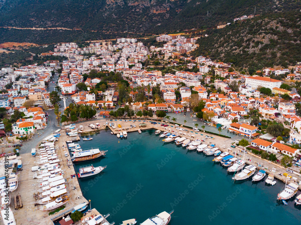 Picturesque aerial view of coastal area and marina in Kas township in Antalya Province of Turkey during sundown