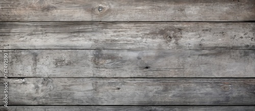 A detailed closeup of a rectangular hardwood wall with a gray wood grain texture resembling brickwork. The pattern adds depth and character to the building material