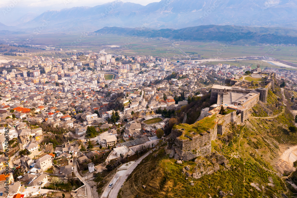 Aerial photo of Gjirokaster city with view of Gjirokaster Fortress, Albania.