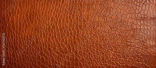 A detailed closeup showcasing the rich amber hues and intricate pattern of a brown leather texture, resembling wood grains and tints of peach stained plywood