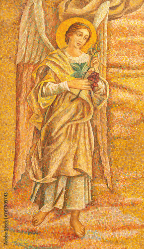MILAN, ITALY - MARCH 4, 2024: The detial of mosaic of angel with the grape in the church Chiesa di San Agostino from 20. cent.