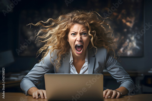 emotionally furious and evil screaming businesswoman in the office with a laptop in the background