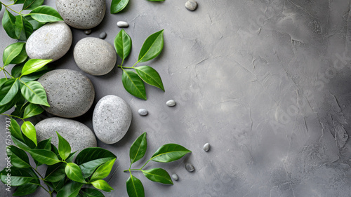 Top view Spa stone and leaves on grey background