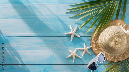 A stylish summer scene featuring a sun hat, sunglasses, and a starfish on a vibrant blue wooden background