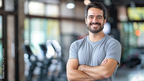Gym, fitness and portrait of proud man standing with smile, motivation, health and energy for training. Coach, personal trainer or happy boxing club owner in studio for workout, coaching and wellness