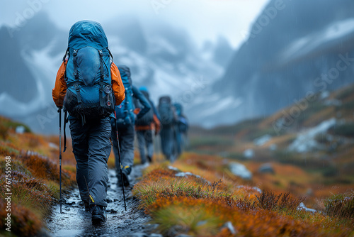 Group of traveling backpacker hiking walk across the little river in Scandinavian mountains.