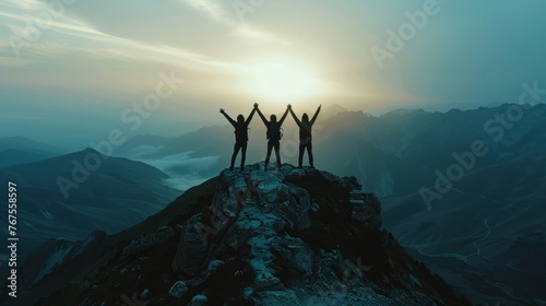 Together overcoming obstacles with three people holding hands up in the air on mountain top , celebrating success and achievements © SHI