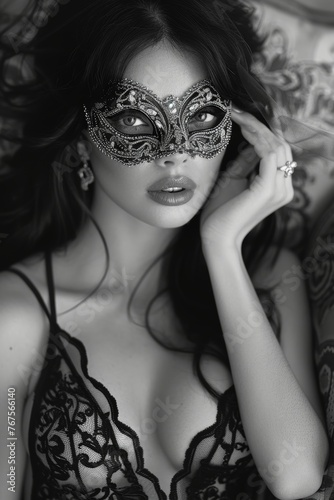 Enigmatic Black-Haired Beauty in Elegant Lace and Masquerade Mask, Lying on her Back, Magic and Fantasy in Black and White. 