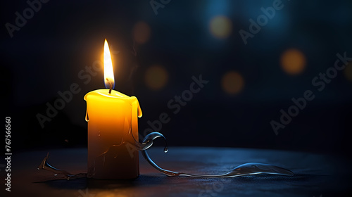 A lonely candle illuminates the foggy room with its beam