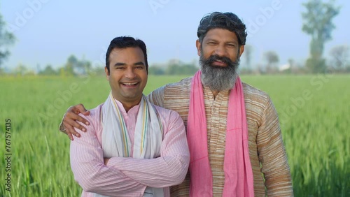 Two desi villagers laughing together on camera - desi lifestyle  desi farmers  agriculture  jai jawan jai kisan  annadata . Two Indian farmer brothers posing for camera - rural lifestyle  brothers ... photo