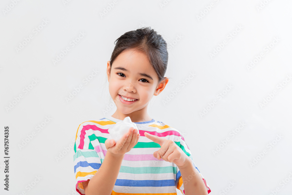 Cute Asian girl, holding foam, washing her face Cute Asian girl, holding foam, washing her face