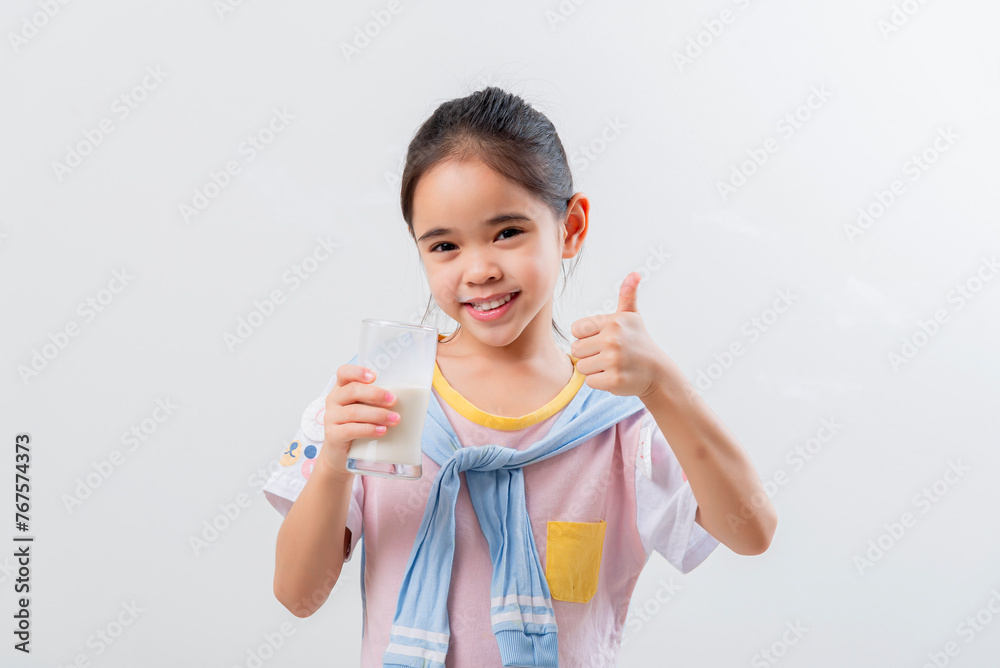 Little Asian girl Image of Asian child drinking milk Little Asian girl Image of Asian child drinking milk