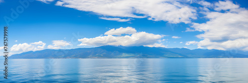 Shades Of Blue: A Visual Symphony Of Sky, Sea, Mountains, And Flowers © Adrian