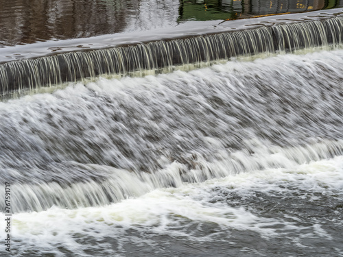 A small flat cascade in a calm river