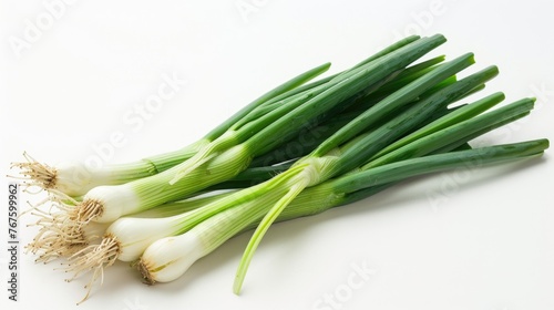 A bunch of green onions are displayed on a white background. The onions are fresh and ready to be used in cooking