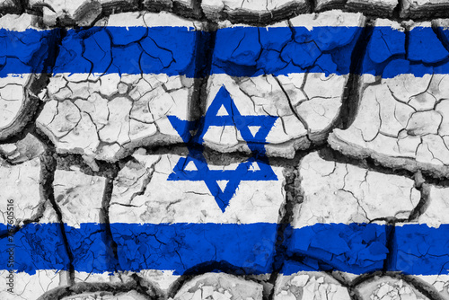 Dry soil pattern on the flag of Israel. Country with drought concept due to climate change. Water problem. Dry cracked earth country.