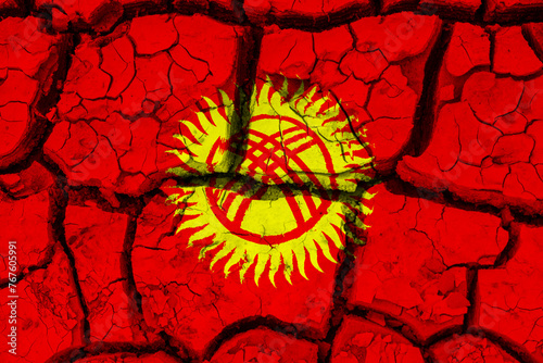 Dry soil pattern on the flag of Kyrgyzstan. Country with drought concept due to climate change. Water problem. Dry cracked earth country.