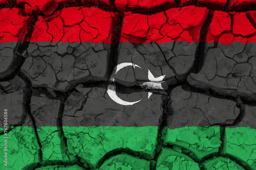 Dry soil pattern on the flag of Lybia. Country with drought concept due to climate change. Water problem. Dry cracked earth country.
