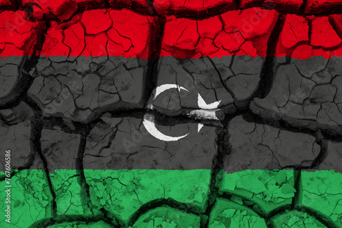 Obraz na płótnie Dry soil pattern on the flag of Lybia. Country with drought concept due to climate change. Water problem. Dry cracked earth country. w salonie