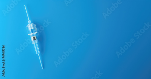 Medical syringe, vials with coronavirus vaccine on light blue background, flat lay., top view. Copy space for text