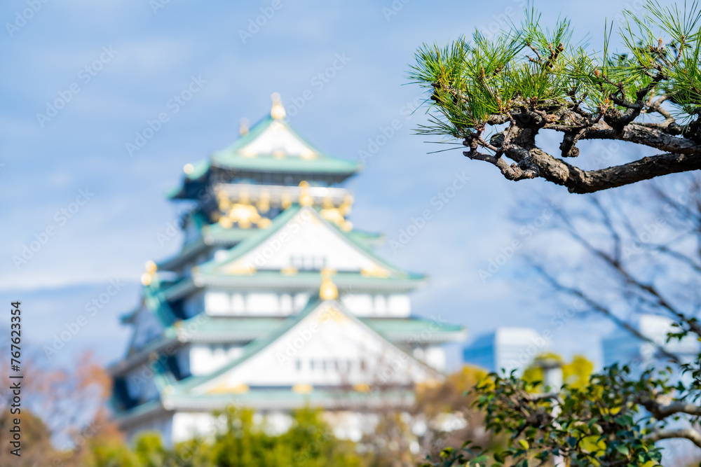 Landscape view Osaka's landmark Osaka Castle castle tower that shines in the blue sky, Osaka Japan. Landscape view Osaka's landmark Osaka Castle castle tower that shines in the blue sky, Osaka Japan.