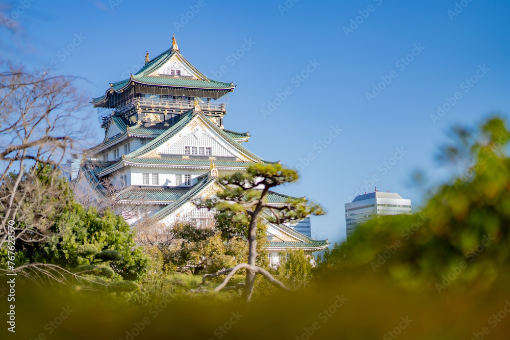Landscape view Osaka's landmark Osaka Castle castle tower that shines in the blue sky, Osaka Japan. Landscape view Osaka's landmark Osaka Castle castle tower that shines in the blue sky, Osaka Japan.