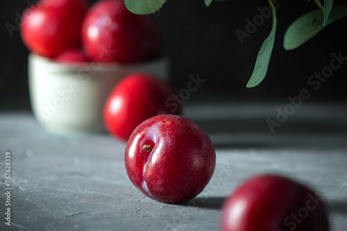 Free sweet red plums on dark background