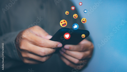 Man use smartphone communication social media with emotion icon.