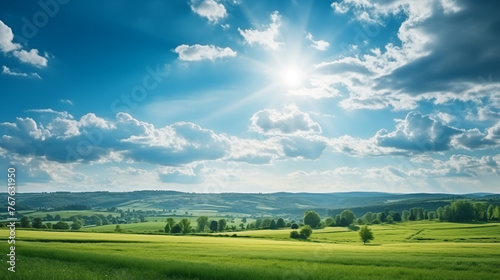 Splendid summer panorama showcasing blue skies, sun-dappled landscapes, and lush grass