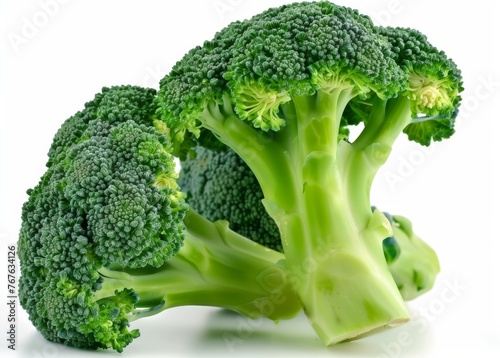 A large green broccoli head sits on a white background