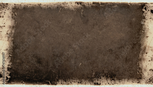 Old photo of a black grunge texture with an artistic brown outline