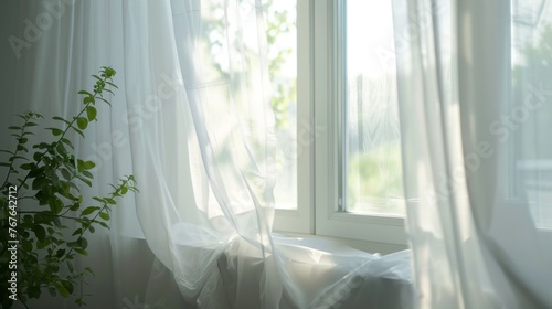 White curtains gently sway in the breeze beside the room's window. © Vladimir